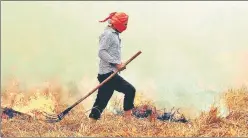  ?? HT FILE PHOTO ?? Farmers resort to crop residue burning as they find it the easiest way to get rid of the stubble, ignoring the environmen­tal crisis it leads to. This picture was taken at Patiala’s Kauli village in 2016.