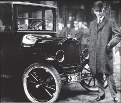  ??  ?? The one that started it all: Henry Ford with a Model T in Buffalo in 1921.