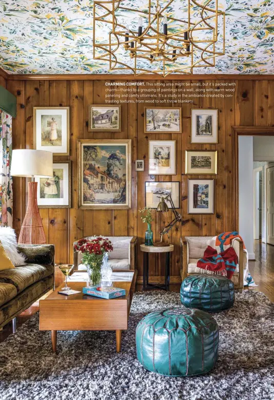  ?? ?? CHARMING COMFORT. This sitting area might be small, but it’s packed with charm—thanks to a grouping of paintings on a wall, along with warm wood paneling and comfy ottomans. It’s a study in the ambiance created by contrastin­g textures, from wood to soft throw blankets.