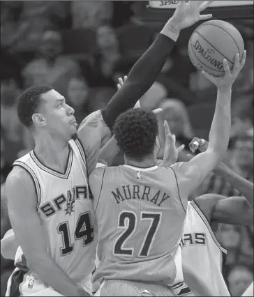  ?? The Associated Press ?? GREEN ACRES: San Antonio guard Danny Green (14) blocks a shot by Denver guard Jamal Murray in the second half of the Spurs’ 118-104 home victory Thursday night.