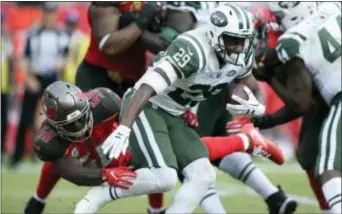  ?? THE ASSOCIATED PRESS ?? Jets running back Bilal Powell (29) is stopped by Tampa Bay Buccaneers linebacker Kwon Alexander during the second half.