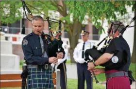  ?? MARIAN DENNIS – DIGITAL FIRST MEDIA ?? Toward the conclusion of the ceremony Friday honoring fallen Montgomery County officers, “Amazing Grace” was played on the bagpipes after 28 names were read aloud.