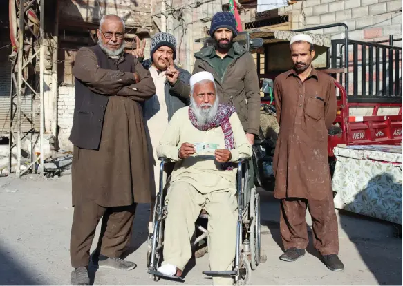  ?? Musa Kamal for The National ?? Voters at a polling station in Peshawar, which was among the cities where the election process was disrupted by cuts to mobile phone services