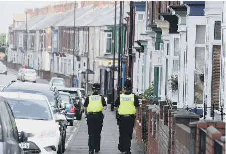  ??  ?? Officer on patrol in Roker Avenue,Sunderland.