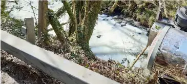  ??  ?? River Dulais in Wales turns white after a milk tanker overturned and spilled its contents.