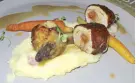  ??  ?? Chicken stuffed with chorizo, bacon mashed potatoes and
sous vide carrots.