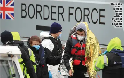  ??  ?? Stem the tide... Border Force staff with a migrant from a boat off Dover