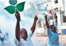  ?? PTI ?? AIADMK party men celebrate after the Election Commission decision, at the party headquarte­rs in Chennai yesterday.