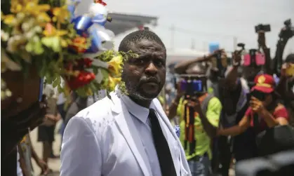  ?? Photograph: Odelyn Joseph/AP ?? Jimmy Chérizier leads a march to demand justice for the murdered president 3Jovenel Moïse in Lower Delmas, Port-au-Prince, in July 2021.