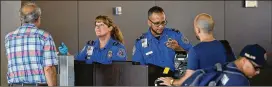  ?? JOSHUA LOTT / NEW YORK TIMES 2016 ?? Transporta­tion Security Administra­tion workers man a checkpoint at O’Hare Internatio­nal Airport in Chicago. President Donald Trump has now made it easier to fire federal workers, and curbed the power of their unions.