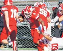  ?? VINCENT D. JOHNSON/DAILY SOUTHTOWN ?? Marist’s Ak’Tavion Agee tries to escape from South Elgin’s Eduardo Ramirez during a Class 8A second-round playoff game on Saturday.