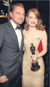  ??  ?? Actor Leonardo DiCaprio and leading actress award-winner Emma Stone.
