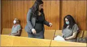  ?? ROD THORNBURG / FOR THE CALIFORNIA­N ?? Jacqueline and Trezell West, the adoptive parents of Orrin and Orson West, sit in Kern County Superior Court at their arraignmen­t March 3. Alekxia Torres Stallings, the attorney for Jacqueline West, walks between the defendants.