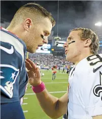  ?? ELSA GETTY IMAGES FILE PHOTO ?? Drew Brees, right, will take the field for the Saints on Sunday two days after turning 42 as the young gun in this matchup against the 43-year-old Tampa Bay QB Tom Brady, who has shattered nearly every record for longevity in the NFL.