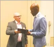  ?? David Borges / Hearst Connecticu­t Media ?? Ray Allen signs his book at the Middlesex Chamber of Commerce breakfast on Thursday.