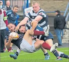  ??  ?? Heriot’s Lloyd Wheeldon and Watsonians’ Cal Davies battle yesterday