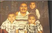  ??  ?? LUIS FUENTES with sons Luis, Alexander and Juan in a family photo. His wife died seven years ago.