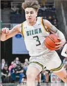  ?? Jim Franco / Times Union ?? Siena freshman Michael Eley, shown on Thursday against Manhattan, had 11 points on Saturday in a 73-72 overtime loss.