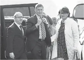  ?? SUSAN WALSH/AP ?? Former Trump national security adviser Michael Flynn, center, arrives at federal court in Washington on Friday.