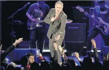  ?? Robert Gauthier Los Angeles Times ?? MORRISSEY greets the die-hard faithful during his performanc­e at the Hollywood Bowl on Friday evening.