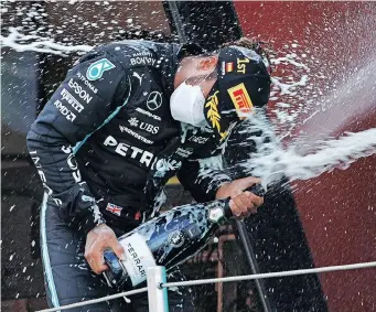  ?? | ALBERT GEA Reuters ?? LEWIS Hamilton celebrates winning the Spanish Grand Prix on the podium yesterday.