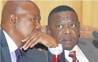  ?? /Business Day ?? Funding: Higher Education directorge­neral Gwebinkund­la Qonde, left, and Minister Blade Nzimande. The department will foot the bill for zero fees increases.