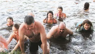  ??  ?? Participan­ts queue to climb out of Grey Dam after Grahamstow­n’s 12th annual Polar Plunge on Tuesday 21 June.