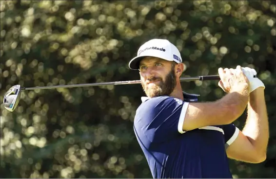  ?? AP file photo ?? Dustin Johnson tees off during the second round of the Masters on Nov. 13. Johnson, the world’s No. 1-ranked player who went on to win his first Masters title, leads a stacked field for next week’s Sentry Tournament of Champions at the Kapalua Plantation Course.