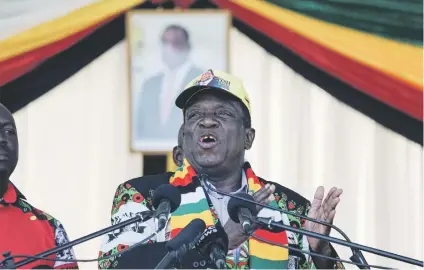  ?? Picture: AFP ?? NARROW ESCAPE. Zimbabwe President Emmerson Mnangagwa addresses a ruling Zanu-PF party rally in Bulawayo on Saturday, shortly before the blast in which more than 40 people were injured.