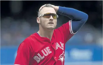  ?? CHRIS YOUNG/ THE CANADIAN PRESS FILES ?? Toronto Blue Jays’ third baseman Josh Donaldson makes his way back to the dug out at the end of first inning American League MLB baseball action against the Houston Astros, in Toronto on Sunday, July 9.