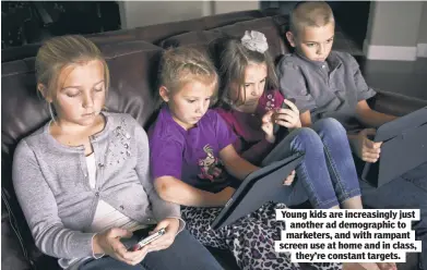  ?? ?? Young kids are increasing­ly just another ad demographi­c to marketers, and with rampant screen use at home and in class, they’re constant targets.