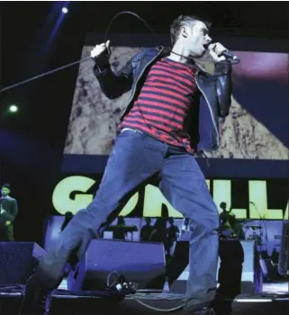  ?? MARK ALLAN — THE ASSOCIATED PRESS FILE ?? In this file photo, the British band Gorillaz performs at London’s O2Arena. The band is one of many musicians using new technology, including 360-degree cameras, virtual reality musical experience­s and vertical videos, to reach the smart phone...
