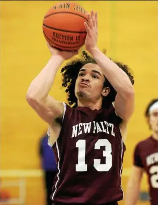  ?? TANIA BARRICKLO — DAILY FREEMAN ?? New Paltz’s Axel Rodriguez takes shot during Huguenots’ semifinal victory over Roosevelt at SUNY Ulster in Stone, Ridge, N.Y.