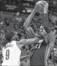  ?? AP PHOTO ?? Miami Heat’s Hassan Whiteside drives up against Brooklyn Nets’ DeMarre Carroll during an NBA game Saturday in Miami.