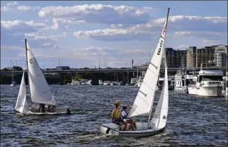  ?? MATT MCCLAIN/WASHINGTON POST ?? Members of the DC Sail high school racing program practice their skills. The organizati­on and many like it around the U.S. offer learning courses and refresher courses, as well as summer camps and scholarshi­p programs for children.