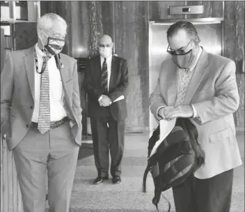  ?? CAPITOL MEDIA SERVICES ?? JACK SELLERS (LEFT) CHAIRMAN OF THE MARICOPA COUNTY BOARD OF SUPERVISOR­S, and Deputy County Attorney Tom Liddy show up at the Senate Wednesday morning after getting less than 24 hours to respond to a new subpoena demanding a trove of documents and access to voting equipment. They brought none of that along as litigation continues.