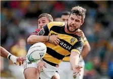  ?? PHOTOSPORT ?? Rhys Marshall of Taranaki offloads in a tackle in 2016. The former shepherd is now playing for Irish province Munster.