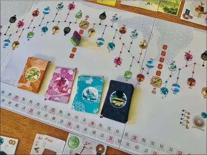  ?? PHOTOS BY JACKIE BURRELL — STAFF ?? In the game of Tokaido, made by Funforge, the winner isn’t the player who finishes first. It’s the one who collects the most varied experience­s — temples, hot springs, panoramas, cuisine — along the way.