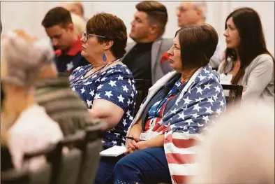  ?? Rebecca S. Gratz / Associated Press ?? Sisters Lori Ediger, left, of Aurora, Neb., and Diana Johnson of Henderson, Neb., listen to presentati­ons during the Nebraska Election Integrity Forum on Aug. 27 in Omaha, Neb.