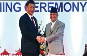  ?? ANI ?? Chinese President Xi Jinping with Nepalese Prime Minister K.P. Sharma Oli in Kathmandu on 13 October 2019.