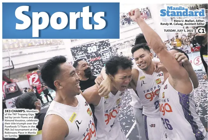  ?? ?? 3X3 CHAMPS. Members of the TNT Tropang Giga, led by Lervin Flores and Almond Vosotros, celebrate their title triumph over the Purefoods TJ Titans in the PBA 3x3 tournament at the Robinsons Place in Manila on Sunday.