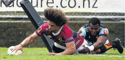  ?? PHOTO: GETTY IMAGES ?? Onehanded . . . Isaac Te Tamaki, of Southland, crosses the tryline in the tackle of Jone Macilai, of Northland, during a round five Mitre 10 Cup match in Whangarei.