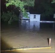  ?? IMAGE COURTESY OF BOB NYCE ?? Perkiomen Creek floodwater­s on their way to the roof of Bob Nyce’s home on Penn Drive Wednesday night.