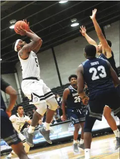  ?? Photo by Ernest A. Brown ?? Bryant forward Sabastian Townes (54) set a new career high with 10 rebounds to go along with 18 points in a 71-63 win over St. Peter’s Wednesday.