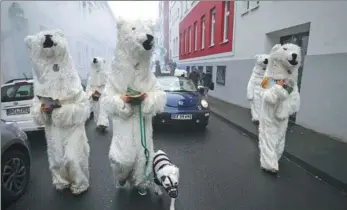  ?? WOLFGANG RATTAY / REUTERS ?? People dressed as polar bears march during a demonstrat­ion in Bonn against the COP 23 UN Climate Change Conference hosted by Fiji but held in Bonn, Germany, on Saturday.