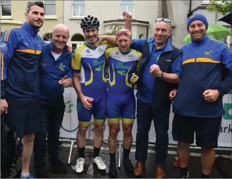  ??  ?? Donore men Niall Craven and Barry Hughes celebrate in Skerries with their team members - manager Andrew Watters, Austin Dennis (physio), Anthony Connor (logistics) and Benner Maguire (mechanic) after finishing the final stage of the Rás Tailteann.