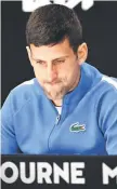  ?? — AFP photo ?? Djokovic reacts at a post-match press conference.