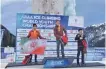  ??  ?? Iran’s Emad Hosseini (L) poses with his silver medal on the second-spot podium at the the 2018 UIAA Ice Climbing World Youth Championsh­ips in Malbun, Liechtenst­ein, on January 7, 2018.