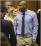  ?? CHRISTIAN GOODEN ST. LOUIS POST-DISPATCH VIA AP ?? Lamar Johnson, center, looks toward friends and family members as his attorneys celebrate on Tuesday.