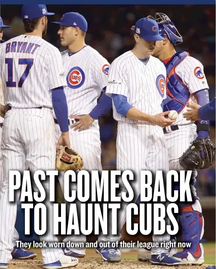  ?? | GETTY IMAGES ?? Manager Joe Maddon takes Kyle Hendricks out of the game in the sixth inning after he allowed three earned runs.